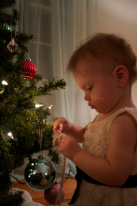 Putting her necklace on the tree